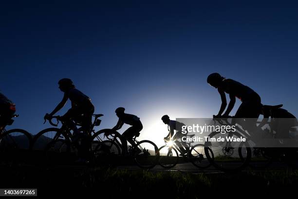 Silhouette of the peloton competing during the 2nd Tour de Suisse Women 2022 - Stage 1 a 46km stage from Vaduz to Vaduz / #ourdesuisse2022 / on June...