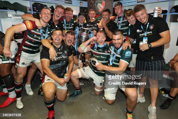 Players of Leicester Tigers celebrate with the Gallagher Premiership Trophy in the changing room after the final whistle of the Gallagher Premiership...