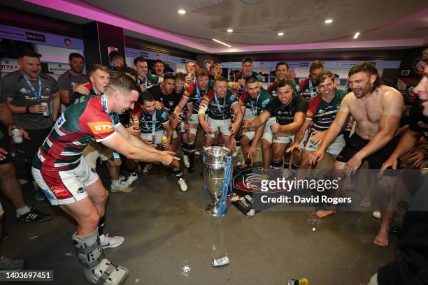 Players of Leicester Tigers celebrate with the Gallagher Premiership Trophy in the changing room after the final whistle of the Gallagher Premiership...