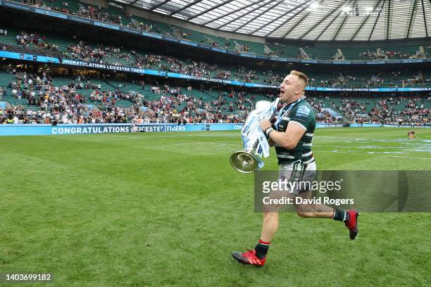 Joe Heyes of Leicester Tigers celebrates with the Gallagher Premiership Trophy after the final whistle of the Gallagher Premiership Rugby Final match...