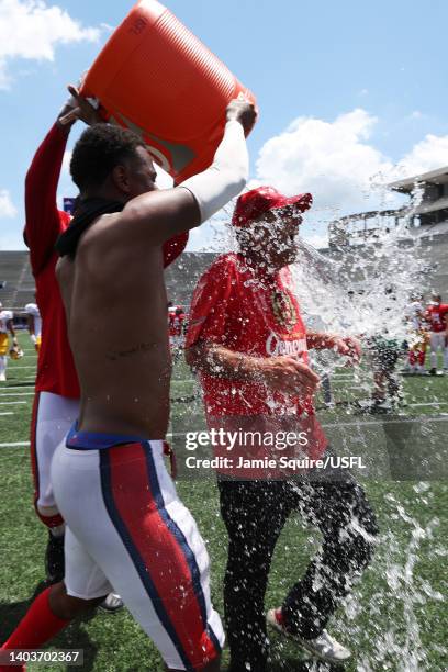 Head coach Mike Riley of the New Jersey Generals reacts as players pour water on him after the New Jersey Generals defeated the Philadelphia Stars...