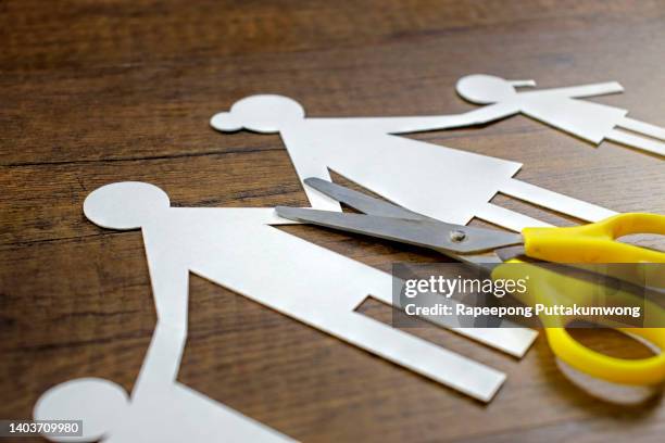 divorce and child custody scissors cutting family apart - family law stockfoto's en -beelden