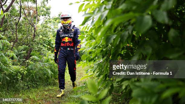 Sergio Perez of Mexico and Oracle Red Bull Racing walks back to the paddock after crashing during qualifying ahead of the F1 Grand Prix of Canada at...