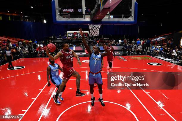 Isaiah Briscoe of the Trilogy looks to pass against Joe Johnson of the Triplets during Week One at Credit Union 1 Arena on June 18, 2022 in Chicago,...