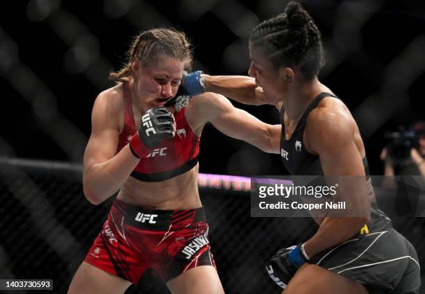 Natalia Silva of Brazil punches Jasmine Jasudavicius of Canada in a flyweight fight during the UFC Fight Night event at Moody Center on June 18, 2022...