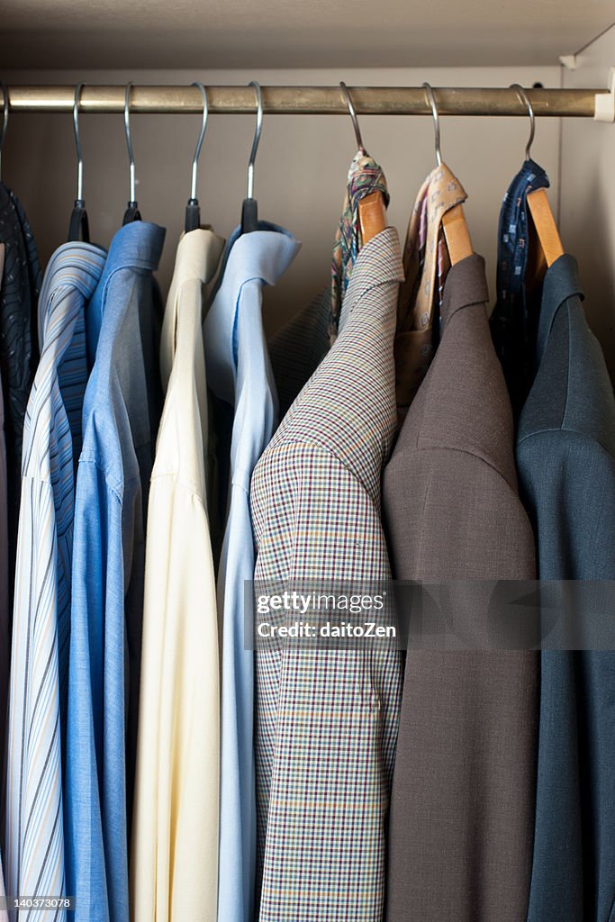 Jackets and shirts in closet
