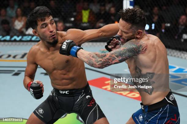 Adrian Yanez punches Tony Kelley in a bantamweight fight during the UFC Fight Night event at Moody Center on June 18, 2022 in Austin, Texas.
