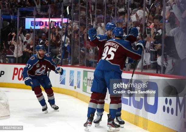 Compher, Mikko Rantanen and Andre Burakovsky of the Colorado Avalanche celebrate Burakovsky's goal against the Tampa Bay Lightning in the first...
