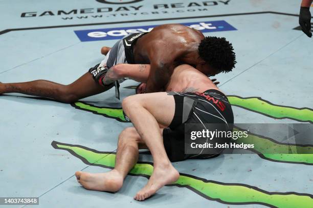 Kevin Holland submits Tim Means in a welterweight fight during the UFC Fight Night event at Moody Center on June 18, 2022 in Austin, Texas.