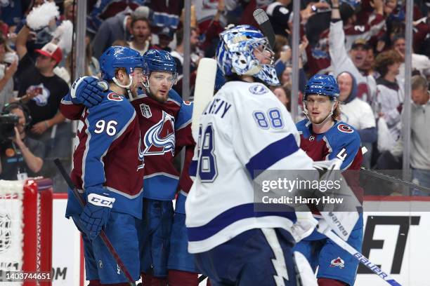 Valeri Nichushkin of the Colorado Avalanche celebrates after scoring a goal with Mikko Rantanen of the Colorado Avalanche as Andrei Vasilevskiy of...