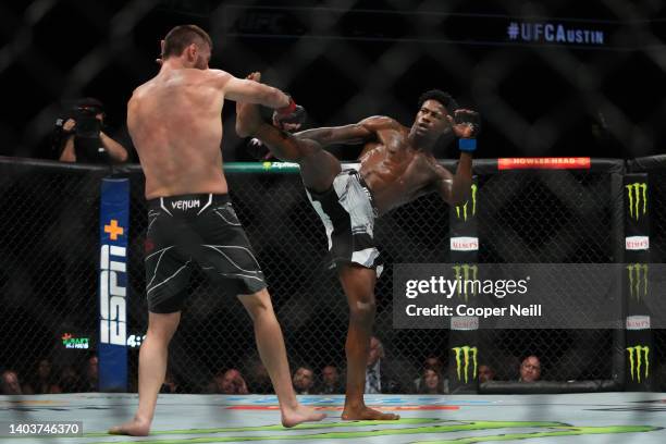 Kevin Holland kicks Tim Means in a welterweight fight during the UFC Fight Night event at Moody Center on June 18, 2022 in Austin, Texas.