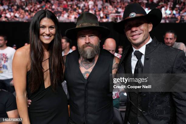 Recording artist Zac Brown of the Zac Brown Band is seen in attendance with a guest and Donald "Cowboy" Cerrone during the UFC Fight Night event at...