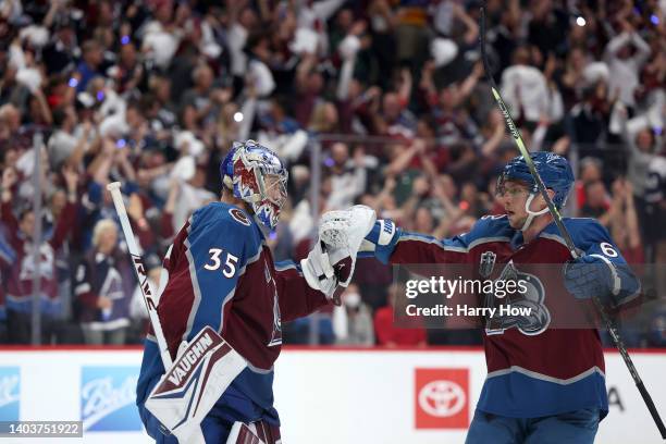 Darcy Kuemper of the Colorado Avalanche celebrates a win with Erik Johnson of the Colorado Avalanche over the Tampa Bay Lightning in Game Two of the...