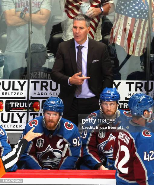 Head coach Jared Bednar of the Colorado Avalanche talks to a referee during the third period in Game Two of the 2022 NHL Stanley Cup Final against...