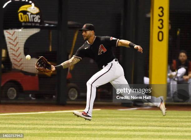 David Peralta of the Arizona Diamondbacks makes a play on a single hit by Trevor Larnach of the Minnesota Twins during the fifth inning at Chase...