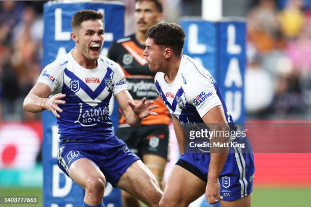 Jake Averillo of the Bulldogs celebrates with Kyle Flanagan after scoring a try during the round 15 NRL match between the Canterbury Bulldogs and the...