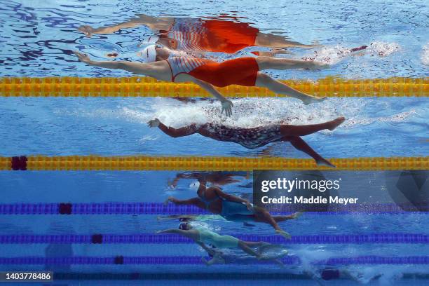 Jimena Leguizamon of Team Colombia and Danielle Titus of Team Barbados competes in the Women's 100m Backstroke heat on day two of the Budapest 2022...