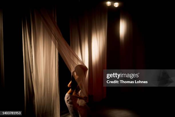 Political performance artist Wai Ting Loretta Lau performs at the stage UK14 stage at the opening day of the documenta 15 modern art fair on June 18,...