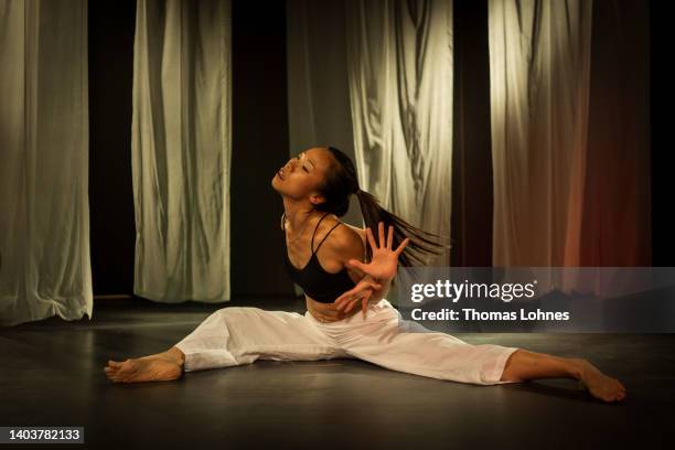 Political performance artist Wai Ting Loretta Lau performs at the stage UK14 stage at the opening day of the documenta 15 modern art fair on June 18,...