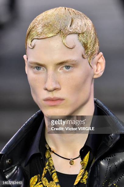 Model walks the runway during the Versace Ready to Wear Spring/Summer 2023 fashion show as part of the Milan Men Fashion Week on June 18, 2022 in...