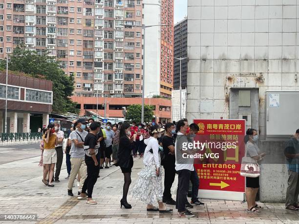 People queue up for COVID-19 nucleic acid tests on June 19, 2022 in Macao, China.