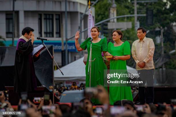 Sara Duterte, together with her father Philippine President Rodrigo Duterte and her mother Elizabeth Zimmerman, takes her oath as the next Vice...