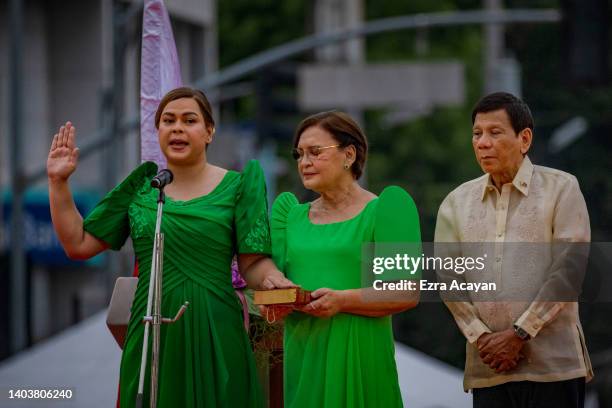 Sara Duterte, together with her father Philippine President Rodrigo Duterte and her mother Elizabeth Zimmerman, takes her oath as the next Vice...