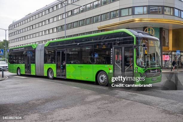 modern bus in the center of a swedish city - skane stock pictures, royalty-free photos & images