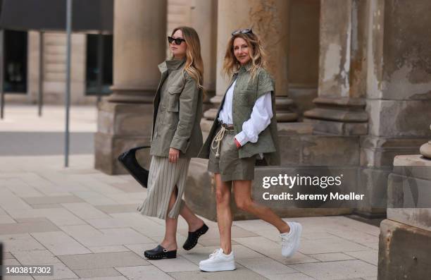 Liesa Späht seen wearing a black sunglasses, a green military jacket from SoSue, a green ripped midi dress from SoSue, a black leather vintage belt,...