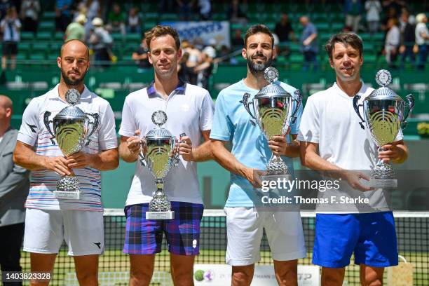 Doubles winners Marcel Granollers of Spain and Horacio Zeballos of Argentina celebrate after winning their match against Tim Puetz of Germany and...