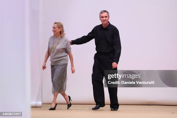 Designer Miuccia Prada and Raf Simons walk the runway at the Prada fashion show during the Milan Fashion Week S/S 2023 on June 19, 2022 in Milan,...