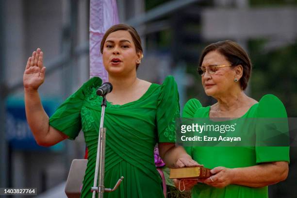 Sara Duterte, together with her mother Elizabeth Zimmerman, takes her oath as the next Vice President on June 19, 2022 in Davao, Philippines. Sara...