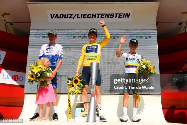 Jakob Fuglsang of Denmark and Team Israel - Premier Tech with his daughter Jamie Lou Fuglsang on third place, race winner Geraint Thomas of The...