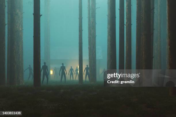 scary walking zombies in dark spooky forest at night - secret sessions stock pictures, royalty-free photos & images