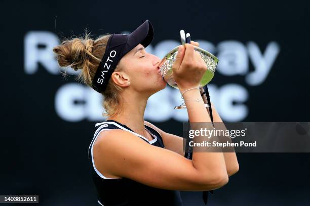 Beatriz Haddad Maia of Brazil celebrates with the Maud Watson Trophy after winning against Shuai Zhang of China in the Singles Final match on Day...