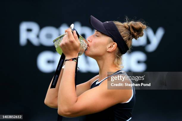 Beatriz Haddad Maia of Brazil celebrates with the Maud Watson Trophy after winning against Shuai Zhang of China in the Singles Final match on Day...