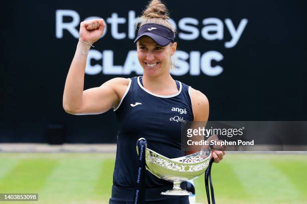 Beatriz Haddad Maia of Brazil celebrates with the Maud Watson Trophy after winning against Shuai Zhang of China in the Singles Final match on Day...
