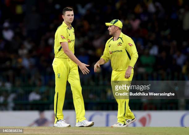 Josh Hazlewood of Australia, left, celebrates with Aaron Finch after dismissing Dhananjaya de Silva of Sri Lanka during the 3rd match in the ODI...