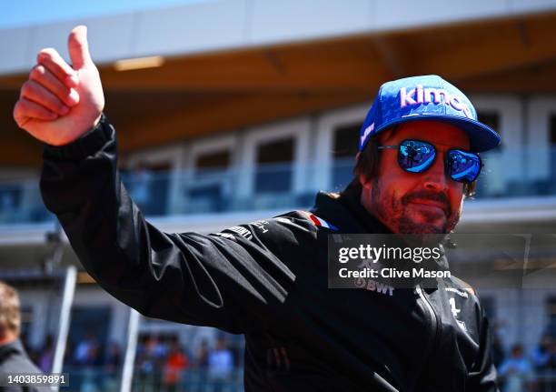 Fernando Alonso of Spain and Alpine F1 waves to the crowd on the drivers parade ahead of the F1 Grand Prix of Canada at Circuit Gilles Villeneuve on...