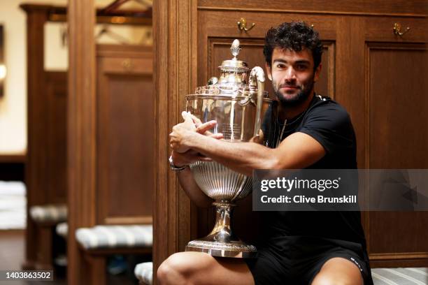 Matteo Berrettini of Italy poses with the trophy in the locker room after winning against Filip Krajinovic of Serbia during the Men's Singles Final...