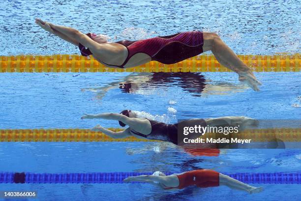 Regan Smith, Claire Curzan of Team United States and Xuwei Peng of Team China compete in the XXXX on day two of the Budapest 2022 FINA World...