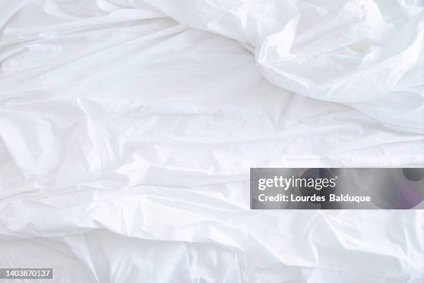 white sheet on the bed - bed overhead view stock pictures, royalty-free photos & images