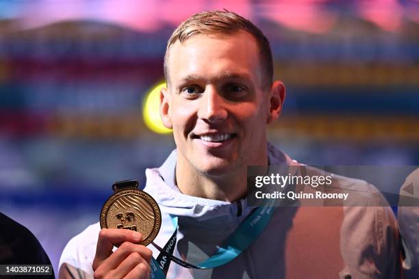 Gold medallist Caeleb Dressel of Team United States poses for a photo in the medal ceremony for the Men's 50m Butterfly Final on day two of the...