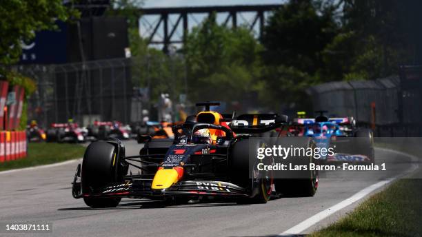 Max Verstappen of the Netherlands driving the Oracle Red Bull Racing RB18 leads the field at the start during the F1 Grand Prix of Canada at Circuit...