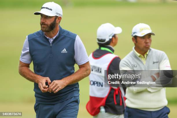 Dustin Johnson of the United States and Hideki Matsuyama of Japan look on from the fourth green during the final round of the 122nd U.S. Open...