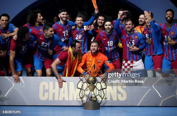 The team of Barca celebrate with the champions league trophy after beating Lomza Vive Kielce after extra time and penalty shoot out during the EHF...