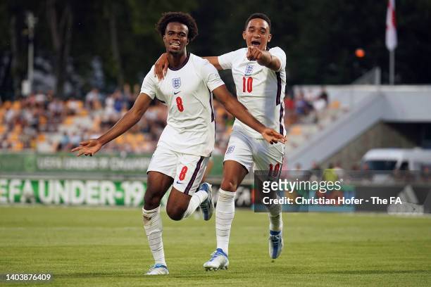 Carney Chunkwuemeka of England celebrates with teammate Aaron Ramsey after scoring their team's first goal during the UEFA European Under-19...
