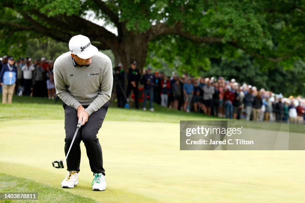 Keegan Bradley of the United States reacts to his missed putt for birdie on the second green during the final round of the 122nd U.S. Open...