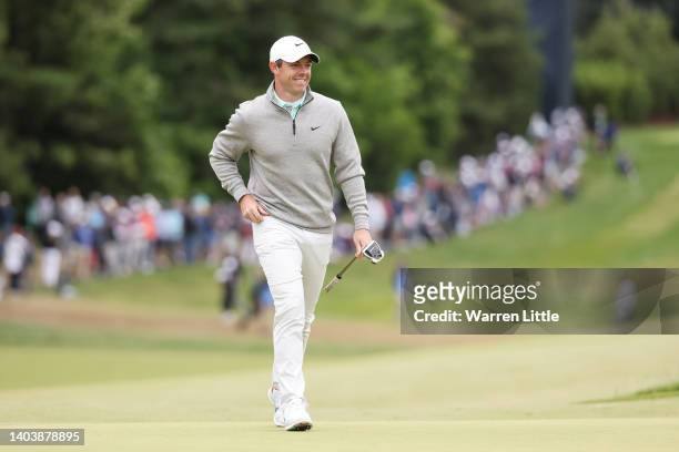 Rory McIlroy of Northern Ireland smiles on the fifth green during the final round of the 122nd U.S. Open Championship at The Country Club on June 19,...