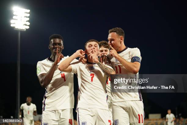 Alfie Devine of England celebrates with teammates after scoring their team's second goal during the UEFA European Under-19 Championship 2022 Group B...